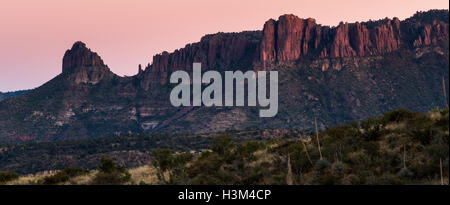 Rocky outcroppings in the Superstition Mountain foothills with atmospheric light after sunset. Tonto National Forest, Arizona Stock Photo