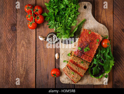 Homemade ground meatloaf with vegetables. Top view Stock Photo