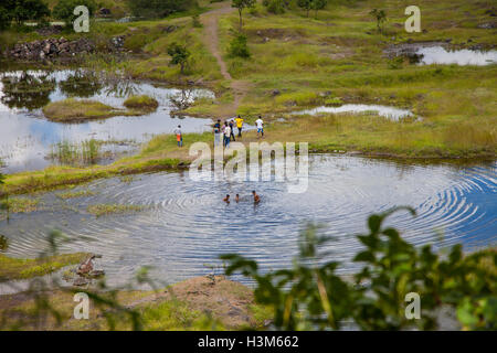 Teenager taking a bath (Pune, India) Stock Photo