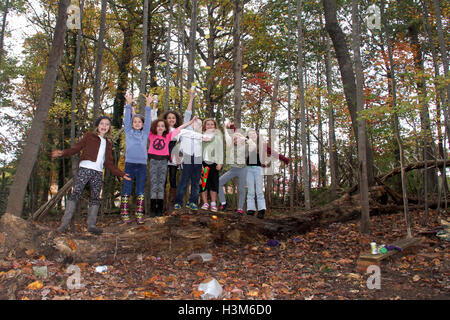 Group of children playing in the woods Stock Photo