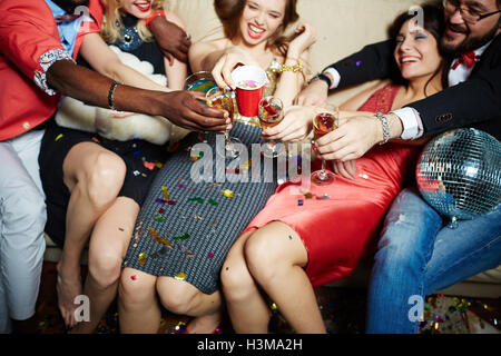 Toasting friends having joyful party Stock Photo