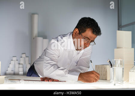 Engineer drawing sketch of architectural construction Stock Photo