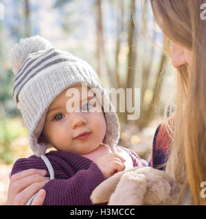 Portrait of baby girl wearing knit hat looking at camera Stock Photo