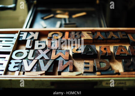 Tray of wooden letterpress letters in book arts workshop Stock Photo