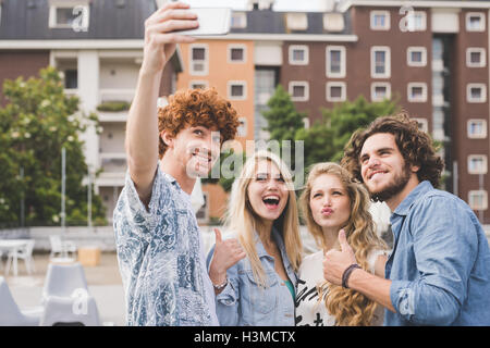 Friends taking selfie outdoors Stock Photo