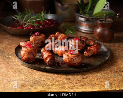 Christmas, celebration food, garnish selection, pigs in blankets, cranberries, rosemary Stock Photo