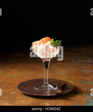 Posh prawn cocktail in wine glass with coriander Stock Photo