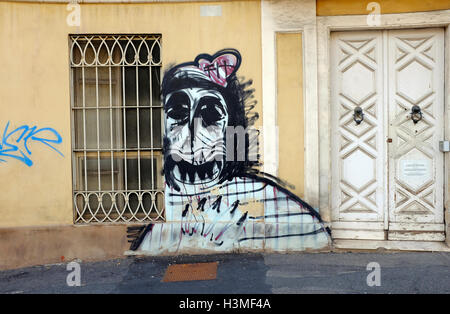 gruesome grafitti style face on building wall, cagliari, sardinia, italy Stock Photo