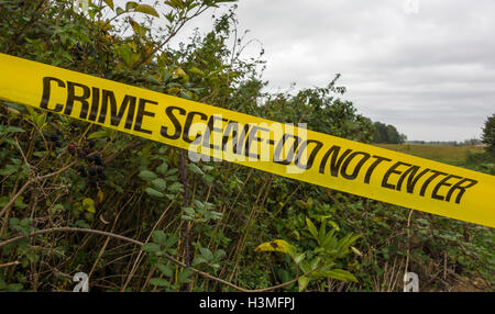 Crime scene Do not enter tape across field entrance Fen Road Milton Cambridge Cambridgeshire England 2016 Stock Photo