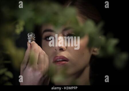 Yasmin Taylor-Salah wears a Fancy Vivid Blue Diamond ring by Cartier at Sotheby&Otilde;s in London, the diamond weighing 8.01 carats and named the Sky Blue Diamond will be sold at auction in Geneva next month and is expected to fetch $15-25 million. Stock Photo