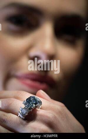 Yasmin Taylor-Salah wears a Fancy Vivid Blue Diamond ring by Cartier at Sotheby&Otilde;s in London, the diamond weighing 8.01 carats and named the Sky Blue Diamond will be sold at auction in Geneva next month and is expected to fetch $15-25 million. Stock Photo