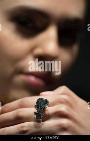 Yasmin Taylor-Salah wears a Fancy Vivid Blue Diamond ring by Cartier at SothebyÃ•s in London, the diamond weighing 8.01 carats and named the Sky Blue Diamond will be sold at auction in Geneva next month and is expected to fetch $15-25 million. Stock Photo