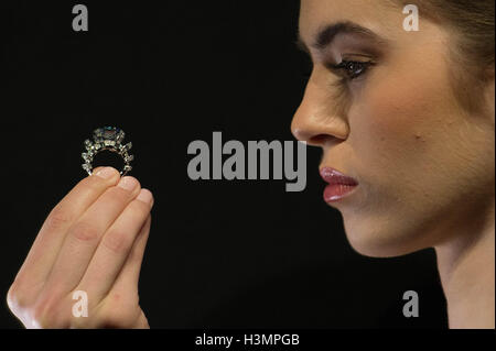 Yasmin Taylor-Salah wears a Fancy Vivid Blue Diamond ring by Cartier at Sotheby's in London, the diamond weighing 8.01 carats and named the Sky Blue Diamond will be sold at auction in Geneva next month and is expected to fetch $15-25 million. Stock Photo