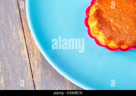 Close up picture of muffin cup cake on a plate, copy space. Stock Photo