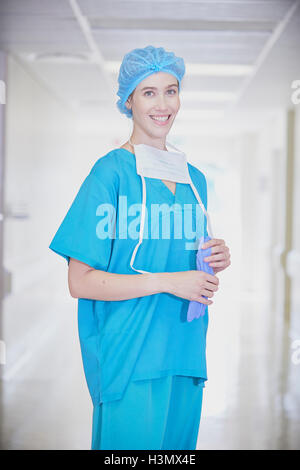 Female medic wearing surgical scrubs cap and mask Stock Photo - Alamy