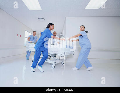 Doctor and medical running with patient bed in hospital emergency Stock Photo