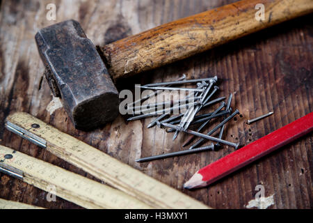 Pencil, nails, hammer, zig zag ruler Stock Photo