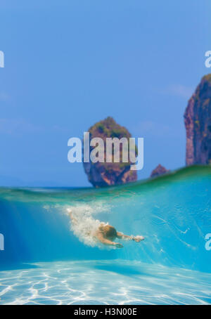 Split photo of a Young women at snorkeling in the tropical water Stock Photo