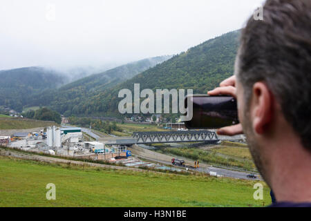 Gloggnitz: construction of Semmering Base Tunnel: start of tunnel, visitor takes picture, Wiener Alpen, Alps, Niederösterreich, Stock Photo