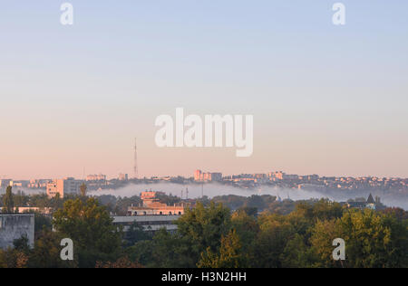 Sunrise with fog over the Valea Morilor lake in Chisinau, Moldova. View on the national tv station antenna Stock Photo