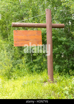Blank wooden sign board dense green forest edge Stock Photo - Alamy