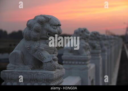 Binzhou, Binzhou, China. 10th Oct, 2016. Binzhou, CHINA-October 10 2016:?(EDITORIAL?USE?ONLY.?CHINA?OUT) A replica of Marco Polo Bridge in Binzhou, east ChinaÂ¡Â¯s Shandong Province, October 10th, 2016. Marco Polo Bridge, also known as Lugou Bridge, is an ancient bridge situated 15km (9.32 miles) southwest of TianÂ¡Â¯anmen Square. It is often said in Beijing that there are countless lions on the?Lugou?Bridge in view of the fact that there are so many finely carved lions to be seen upon it. In the replica of the Marco Polo Bridge, there are also some elaborately carved lions. (Credit Image: Stock Photo