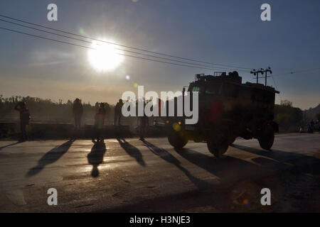 Srinagar, Kashmir. 11th October, 2016. Indian army soldiers arrive near the site of a gun battle between Indian security forces and militants on the outskirts of Srinagar Oct 11, 2016. Credit:  Saqib Majeed/Alamy Live News Stock Photo