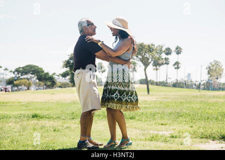 Senior couple dancing outdoors, Long Beach, California, USA Stock Photo