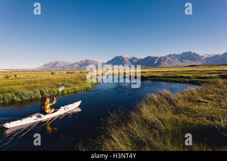 Man kayaking on river, Mammoth Lakes, California, USA Stock Photo