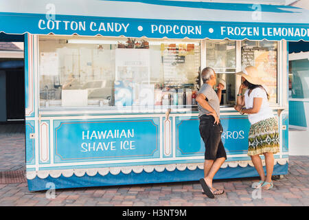 Senior couple standing beside refreshment stand, Long Beach, California, USA Stock Photo