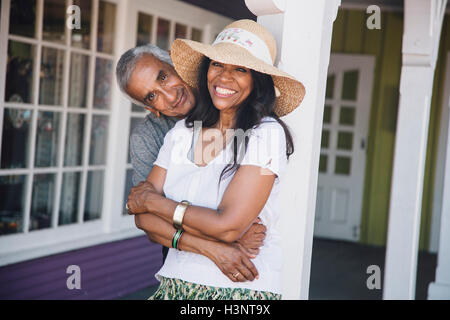 Portrait of senior couple hugging, laughing Stock Photo