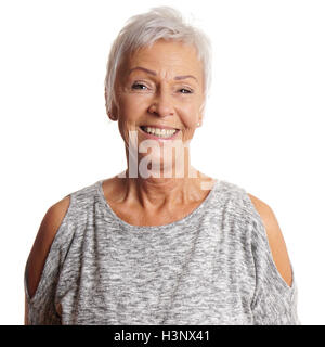 Beautiful slim mature woman short hairstyle stands posing in mini dress.  Fashion stylish clothes Stock Photo by annazzhuk