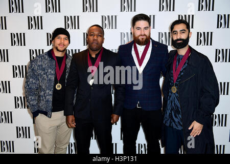 Rudimental's Kesi Dryden (left), DJ Locksmith (second left), Piers Agget (second right) and Amir Amor (right) attending the BMI London Awards at the Dorchester Hotel, London. Stock Photo