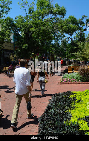 Pedestrians  visit Pearl Street Mall in Boulder, CO, during a late summer Stock Photo