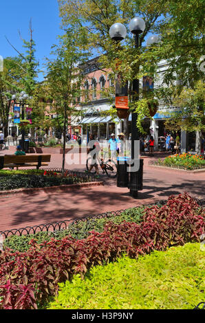 Pedestrians and biker, visit Pearl Street during a late summer Stock Photo