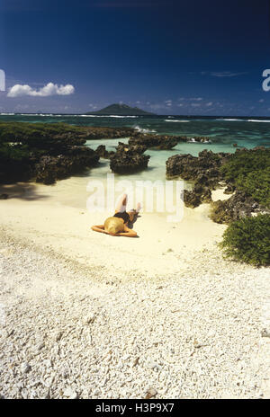 Naked woman sunbathing on beach Stock Photo - Alamy