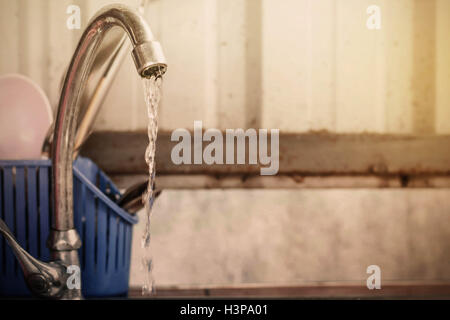 Forgot to turn off the faucets in the kitchen. Stock Photo