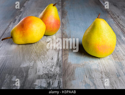 Pears  on an old wooden table (close-up shot). Stock Photo