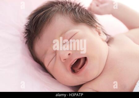 MODEL RELEASED. Newborn baby girl with eyes closed. Stock Photo