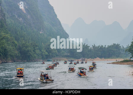 Many Bamboo Rafts on the Li river in the haze near Yangshuo, China Stock Photo