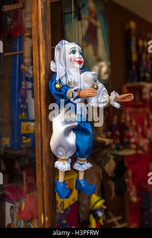 Prague, Czech Republic - 8 May, 2013: Prague souvenirs, traditional puppets made from wood in the gift shop. . Stock Photo