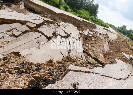 asphalt road collapsed and fallen, since the ground collapsing. Stock Photo