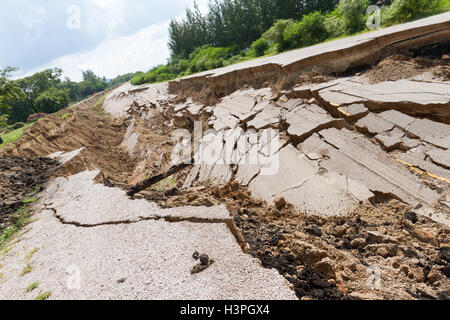asphalt road collapsed and fallen, since the ground collapsing. Stock Photo