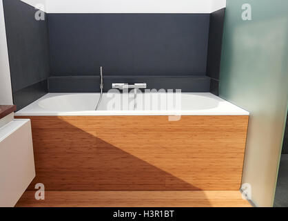 Interior, white bathtub in wooden finition Stock Photo