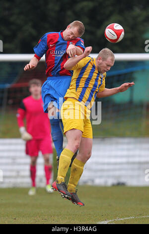 Kieron English of Romford in an aerial battle with Billy Sendall of Maldon - Maldon & Tiptree vs Romford - Ryman League Division One North Football - 16/03/13 Stock Photo