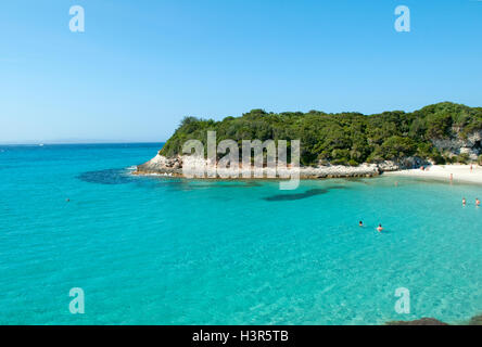 Some tourist swimming on beautiful Petit Sperone beach, Corsica island, France Stock Photo