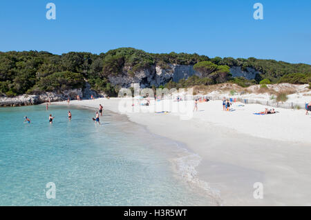 Some tourist relaxing on beautiful Petit Sperone beach, Corsica island, France Stock Photo