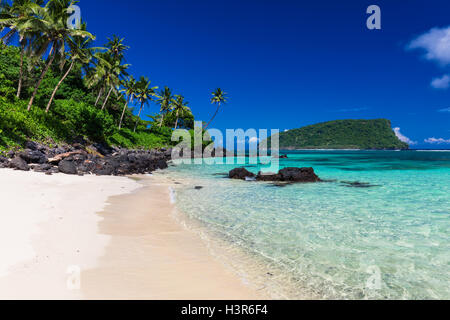 Vibrant tropical Lalomanu beach on Samoa Island with coconut palm trees Stock Photo