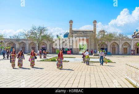 The girls dressed in national costumes because of the Holiday of Fountains in Samarkand. Stock Photo