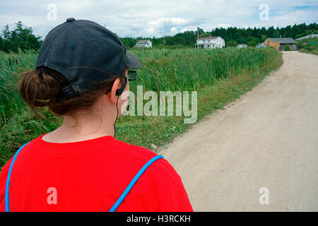 A 14 year old girl hiking on Big Tancook Island, Nova Scotia, Canada Stock Photo